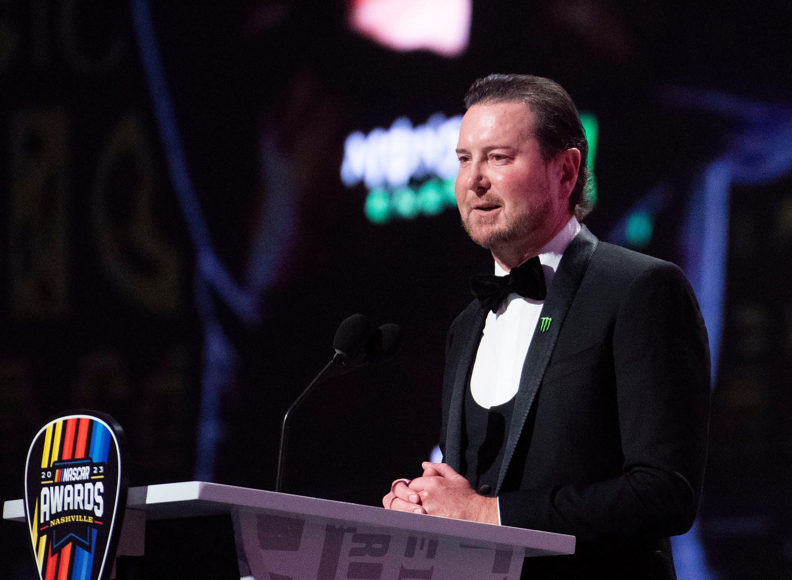 Retired NASCAR Cup Series driver Kurt Busch speaks onstage at the 2023 NASCAR Awards Banquet - Source: Imagn